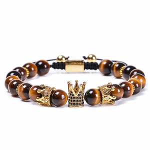 8mm natural tiger eye stone bracelet set with golden crown charms on white background