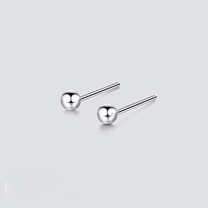 Macro shot of 4mm 316L stainless steel ball stud earrings with a high-polished silver finish