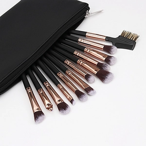 Makeup brush set in champagne gold and black with a stylish black PU leather zipper pouch
