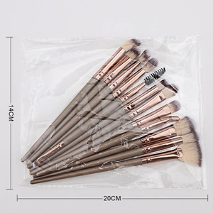 Detailed view of 14-piece makeup brush set with rose gold ferrules in 20cm packaging
