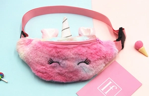 Detail of plush unicorn fanny pack with sequined horn and embroidered sleepy eyes