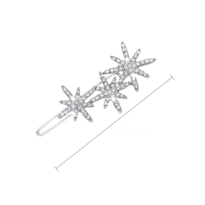 Detailed view of silver star hair clip with crystals measuring 6cm and weighing 6.4g