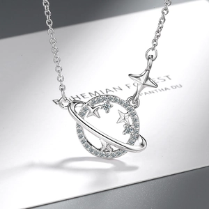 Silver planet and star pendant necklace with sparkling crystals on a minimalist chain