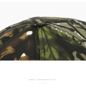 Close-up of camouflage baseball cap crown showing durable stitching and top button detail