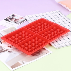 Close-up of a 4-cavity red silicone waffle mold with professional grid texture details