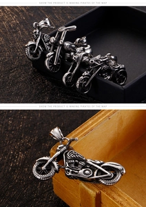 Detailed view of punk stainless steel motorcycle pendant with skull motifs and vintage finish