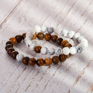 DIY tiger eye and turquoise beaded bracelet on a natural wood surface with soft shadows