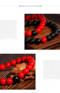 Detailed macro of 8mm matte black onyx and red stone beads on elastic bracelet