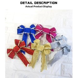 Detailed view of colorful glitter Christmas tree bows with metallic edge piping
