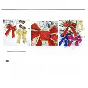 Detailed view of glittered multi-loop Christmas bows in various festive colors and sizes