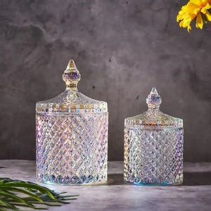 Set of iridescent glass storage jars with diamond cut texture and lids in two sizes