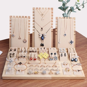 Natural wood jewelry display set with beige velvet lining for necklaces and rings