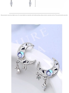 Macro detail of crescent moon earrings with iridescent stones and star tassels