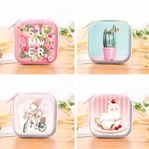 Detailed grid view of four square coin purses with flamingo, cactus, and bunny patterns