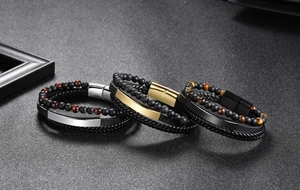 Detail view of multi-layer leather bracelets with tiger eye beads and magnetic clasp