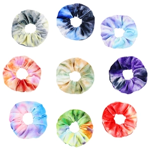 9-piece set of tie-dye velvet hair scrunchies in vibrant gradient colors on white background