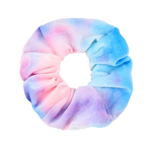 Close-up of tie-dye velvet scrunchie in blue, pink, and purple on a white background