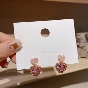 Elegant Korean style pink heart drop earrings featuring pink zircons and gold plating