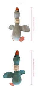 Detailed view of plush wild goose dog toy in grey and teal with textured cotton fabric