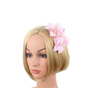 Pink orchid flower hair comb on blonde model for bridal bohemian wedding headpiece