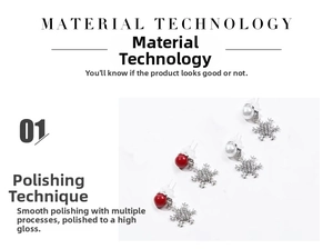 Detailed view of snowflake earrings with red beads and white pearls in polished finish