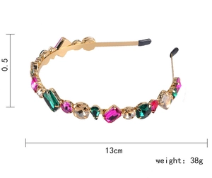 Macro shot of 13cm golden wire headband with colorful faceted crystals and weight label