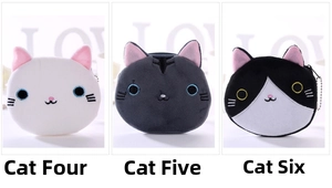Detailed view of three cat-shaped plush coin purses with zipper and metal chains