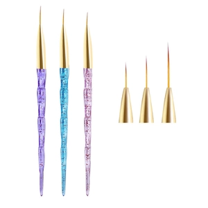 Detailed macro of professional nail art liner brushes with acrylic glitter wave handles