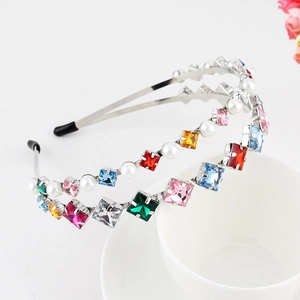 Detail of double-layer metal headband with colorful rhinestones and white faux pearls