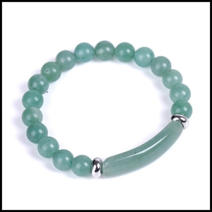 Detailed view of green aventurine stone beads and curved stainless steel tube on bracelet