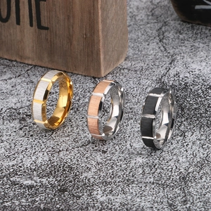 Three octagonal brushed stainless steel rings in gold, rose gold and black finish