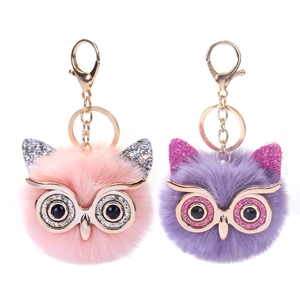 Glittery owl faux fur keychain in pink and purple with gold tone metal clip rings