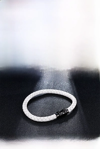Close-up of woven microfiber leather bracelets in multiple colors with magnetic clasps
