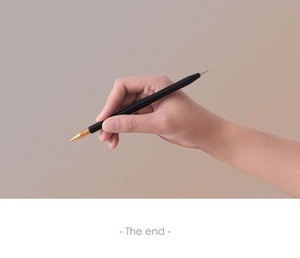Detail of a precision scratch painting pen tool with gold tip and non-slip black handle