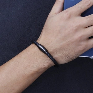 Men's braided black microfiber leather bracelet with matte magnetic clasp on wrist