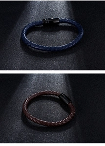 Detail of woven leather bracelets in blue and brown with black matte magnetic clasps