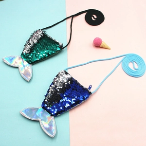 Close-up of green and blue reversible sequins on mermaid tail coin purse with laser PU