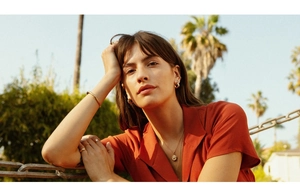 Outdoor model shot of 18K gold plated stainless steel layered necklace and jewelry set