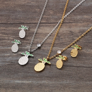 Cute gold and silver pineapple necklace and stud earring set with green enamel and zircons