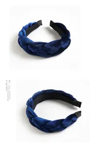 Macro detail of braided navy blue velvet headband featuring thick woven fabric and soft texture