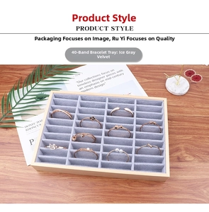 Detail of 40-slot wooden jewelry tray with ice gray velvet for bracelet display