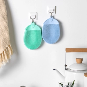 Reusable TPE silicone cleaning brush gloves for dishwashing and kitchen tasks hanging on hooks