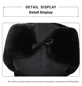 Detail view of the plush faux fur lining and ear flaps on a black winter trapper hat