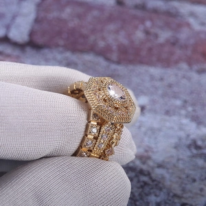 Elegant gold-plated geometric ring set with oval-cut zircon and pave-set accents