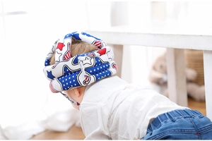 Detail of the soft infant safety helmet featuring a red white and blue American flag pattern