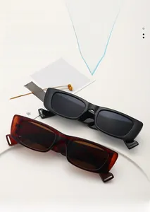 Detail view of stylish rectangular sunglasses in black and tortoiseshell acetate