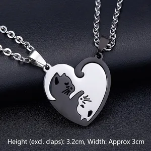 Detailed view of black and silver cat couple necklace pendant measuring 3.2cm by 3cm