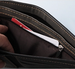 Detail view of men's leather wallet featuring multiple card slots and zipper pocket