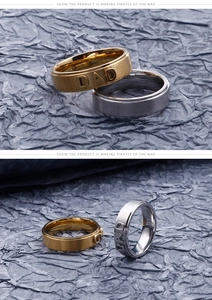 Detailed view of gold and silver stainless steel rings with 3D DAD letter engraving