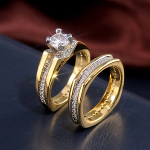 Macro shot of 18K gold plated wedding ring set with sparkling AAA cubic zirconia